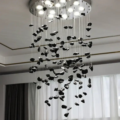 Modern amber and gold colorful crystal stone chandelier with black irregular stone pendant and circular metallic base for dining room decorbites colorful crystal