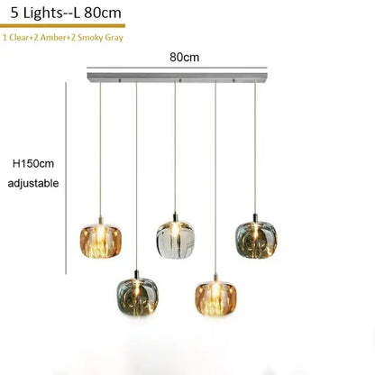 Modern amber and gold crystal led chandelier with five glass globe shades in clear, amber, and smoky gray hues