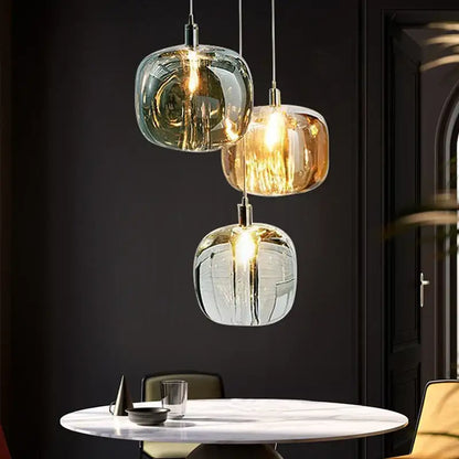 Modern amber and gold crystal led chandelier with three frosted green amber and clear glass pendant lights by decorbites crystal led
