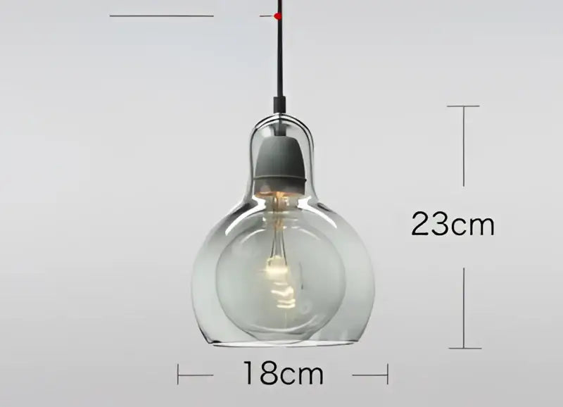 Modern amber and gray glass pendant lights featuring clear glass pendant lights with visible filament bulbs for dining room