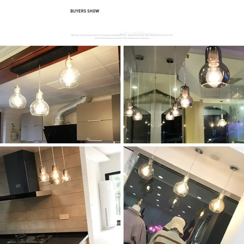 Modern amber and gray glass pendant lights with warm glowing bulbs and sleek metal fixtures for dining room use