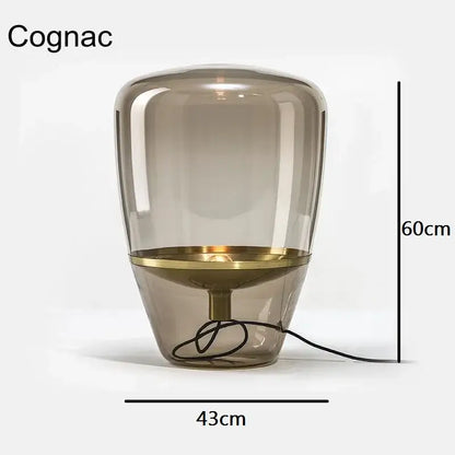 A sleek 60cm cognac-colored balloons led glass table lamp with brass accents for modern home office use