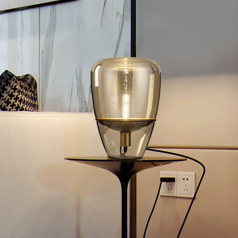 Modern amber balloons led glass table lamp with translucent amber glass shade and black metal base for home office use