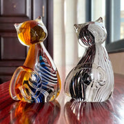 Modern amber and black glass cat figurine set featuring two hand-blown glass cat figurines for living room decor