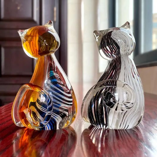 Modern amber and black glass cat figurine set featuring two hand-blown glass cat figurines for living room decor