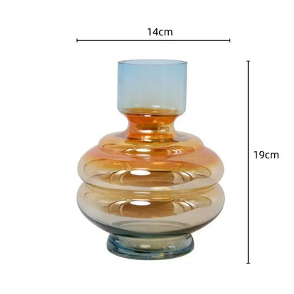 A sleek layered gradient glass vase with amber and blue hues perfect for modern living room decor by decorbites gradient glass