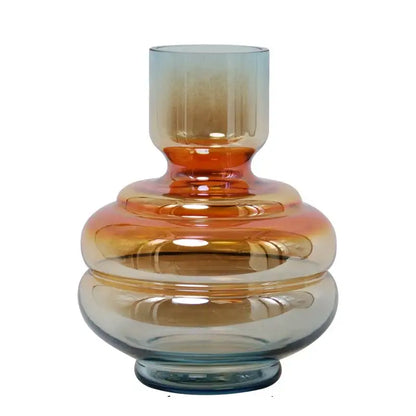 A sleek decorbites gradient glass vase in amber and teal hues ideal for modern living room decor