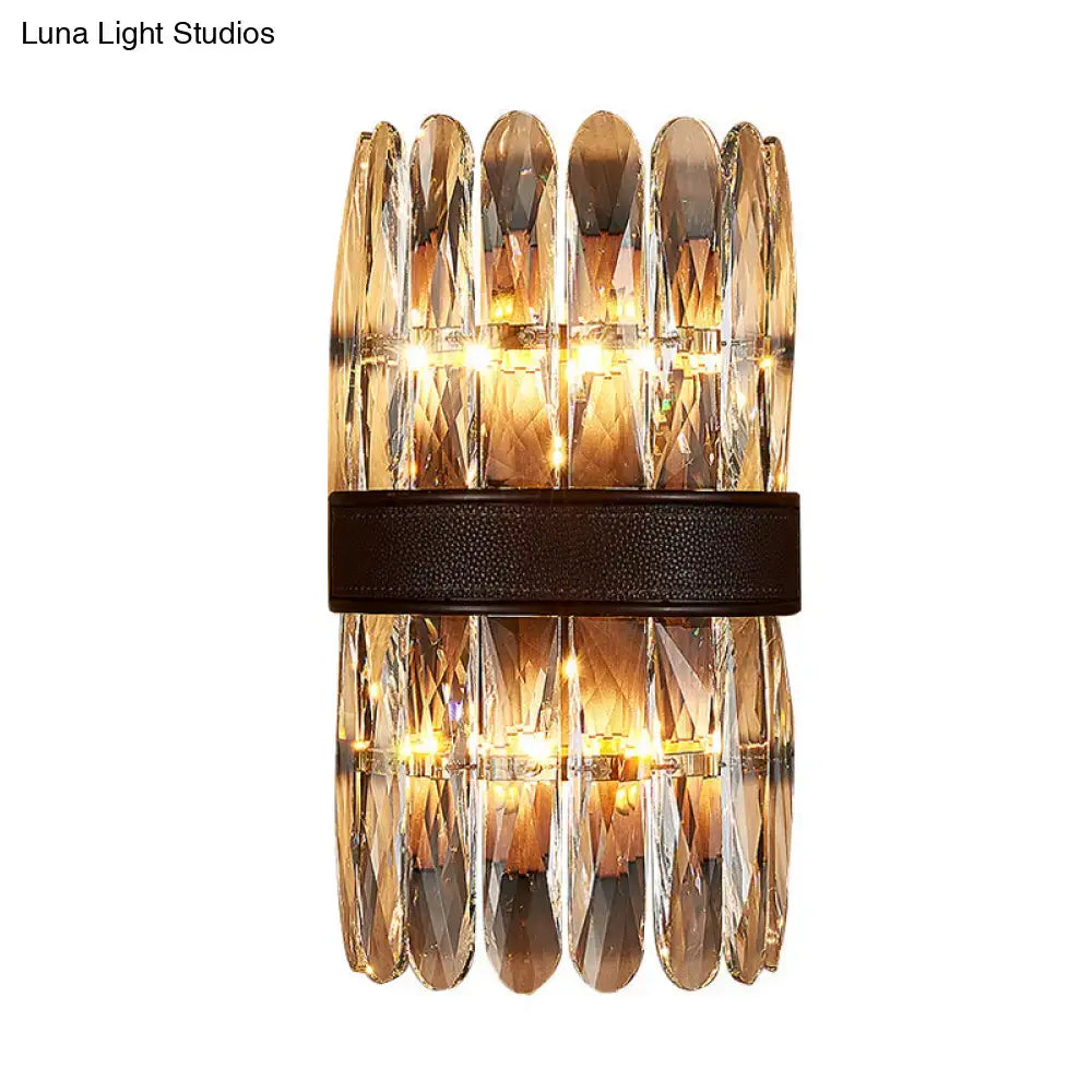 Modern amber and clear crystal wall sconce with faceted prisms and dark brown leather band direct wired electric power source