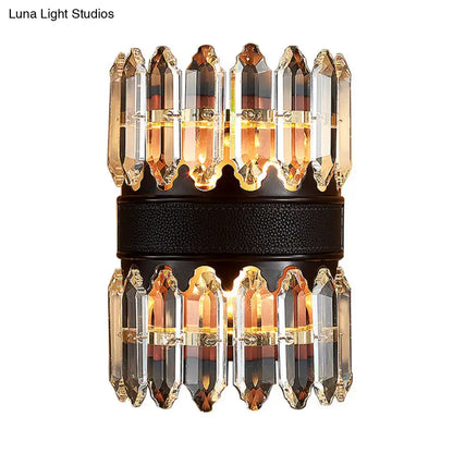 Elegant modern amber and clear crystal wall sconce with two tiers and black textured band for direct wired electric use