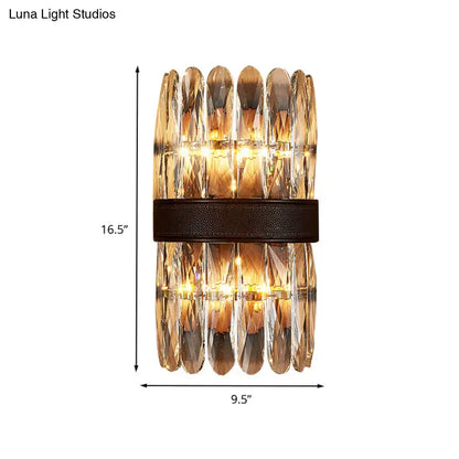 Modern amber and clear crystal wall sconce with faceted amber crystals and dark leather strap for direct wired electric use