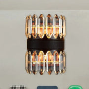Elegant modern amber and clear crystal wall sconce with faceted prisms on dark leather band direct wired electric light