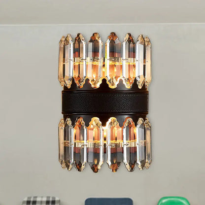 Elegant modern amber and clear crystal wall sconce with faceted prisms on dark leather band direct wired electric light