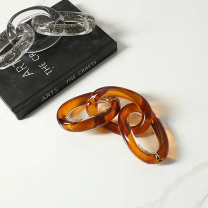 Translucent amber-colored glass chain link bracelet with a glossy smooth finish for decorbites colorful geometric ring decor