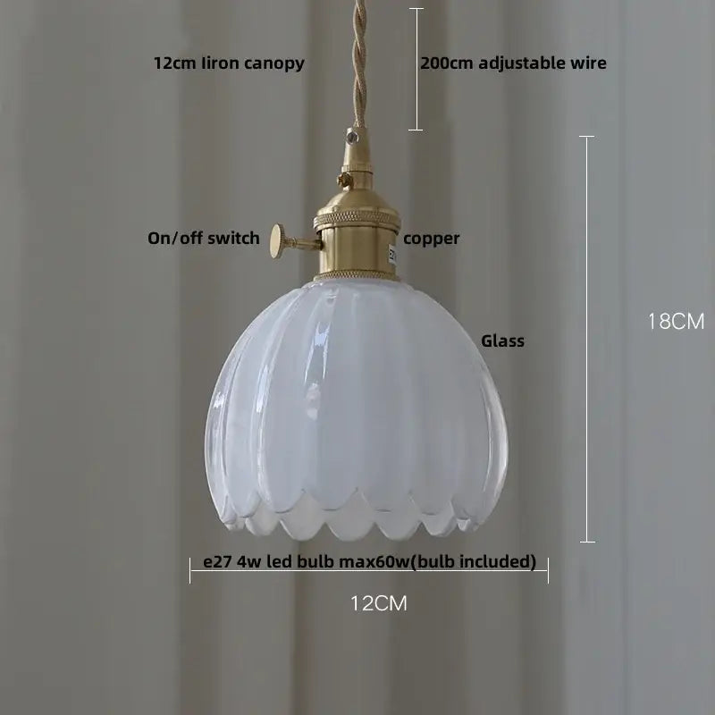 A white ribbed glass pendant light with brass copper-finished fixture and adjustable wire suspension decorbites copper glass