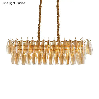 Gold-toned modern amber crystal oval island light fixture with faceted glass crystals for dining room use