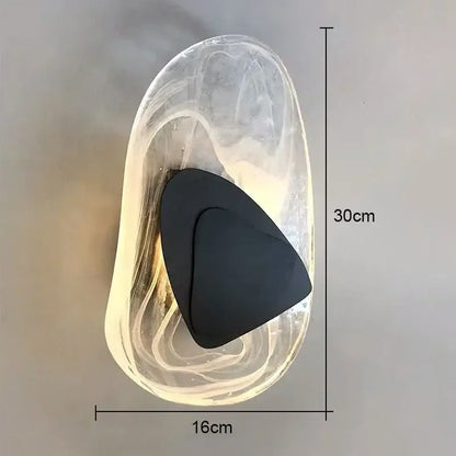 Modern amber crystal wall lamp with sculptural translucent glass body and sleek black backplate for bedroom decorbites crystal wall light