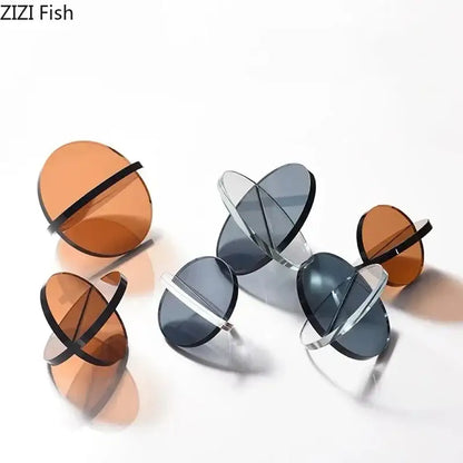 Modern amber geometric cross ornaments living room bookends with clear and amber glass discs and black silver crossbars by zizi fish