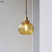 Modern amber glass ball led pendant light with warm amber glass and brass fixture for dining room lighting