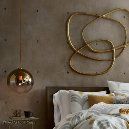 Modern amber glass ball led pendant light with gold-toned reflective spherical glass ball led fixture for kitchen decorbites decor