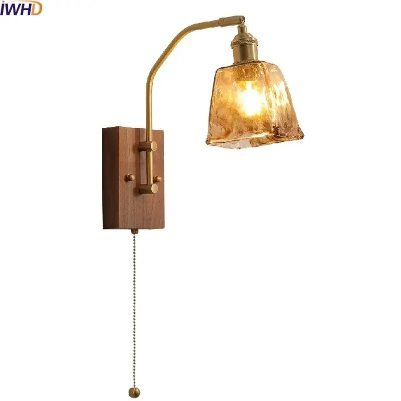 Brass-finished wall lamp with wooden base and textured amber glass copper led shade for modern bedroom lighting