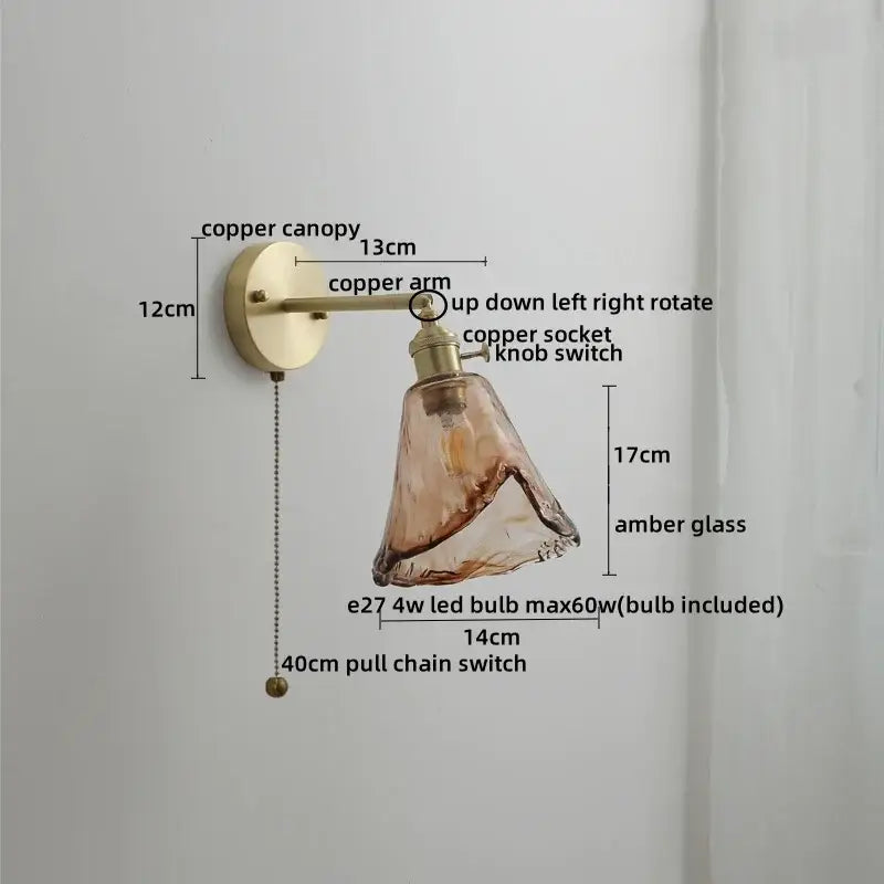 Copper led wall lamp with amber glass shade and pull chain switch designed as a modern bedroom sconce