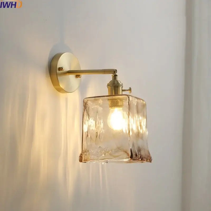 Brass-finished modern amber glass copper led wall lamp with textured amber-tinted glass shade for bedroom sconce