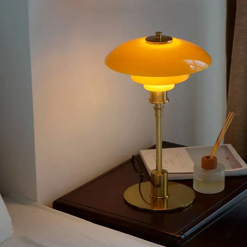 Modern amber glass desk lamp with golden brass base and warm amber shade for home office decorbites glass desk lamp