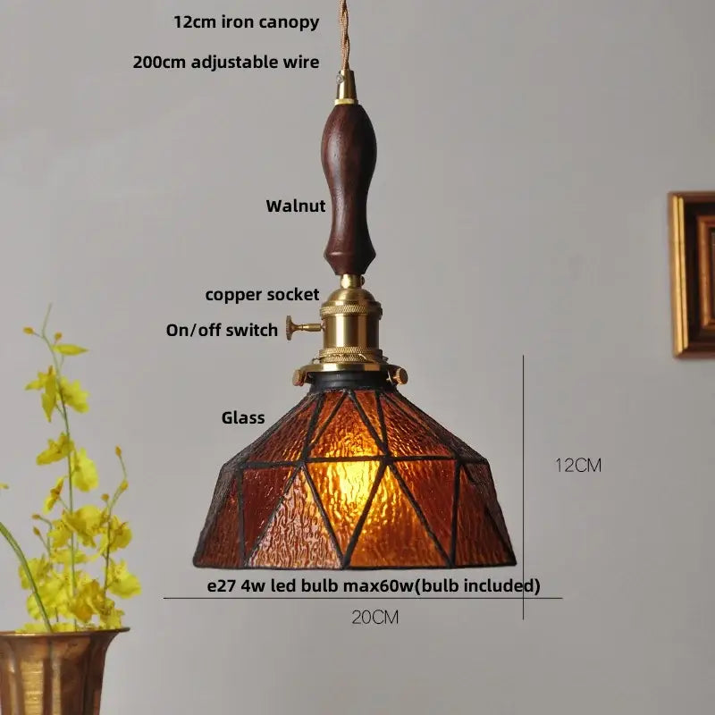 Modern amber glass led pendant lamp with warm amber glass led shade, walnut wood handle, and brass accents for dining room