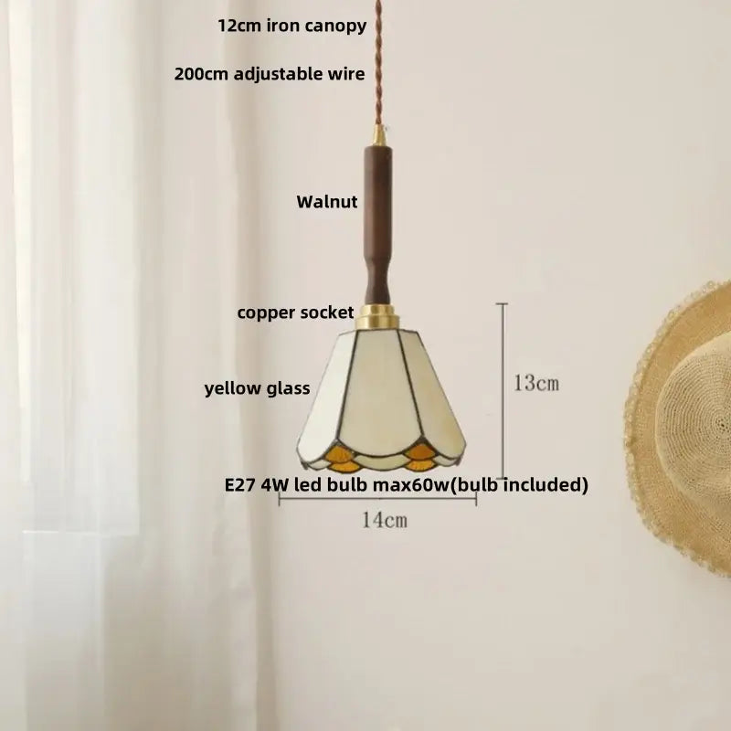 Modern amber glass led pendant light with walnut-finished iron canopy and yellow-tinted decorbites amber glass shade