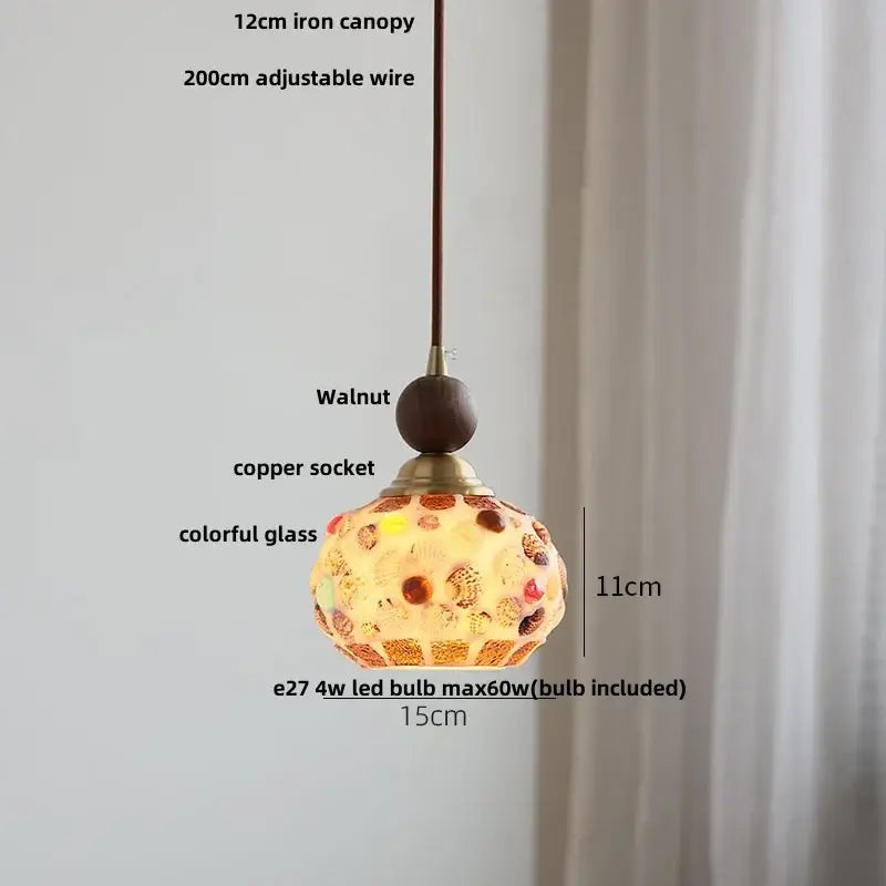 Modern amber glass led pendant light featuring a spherical mosaic of colorful glass and seashells for dining room