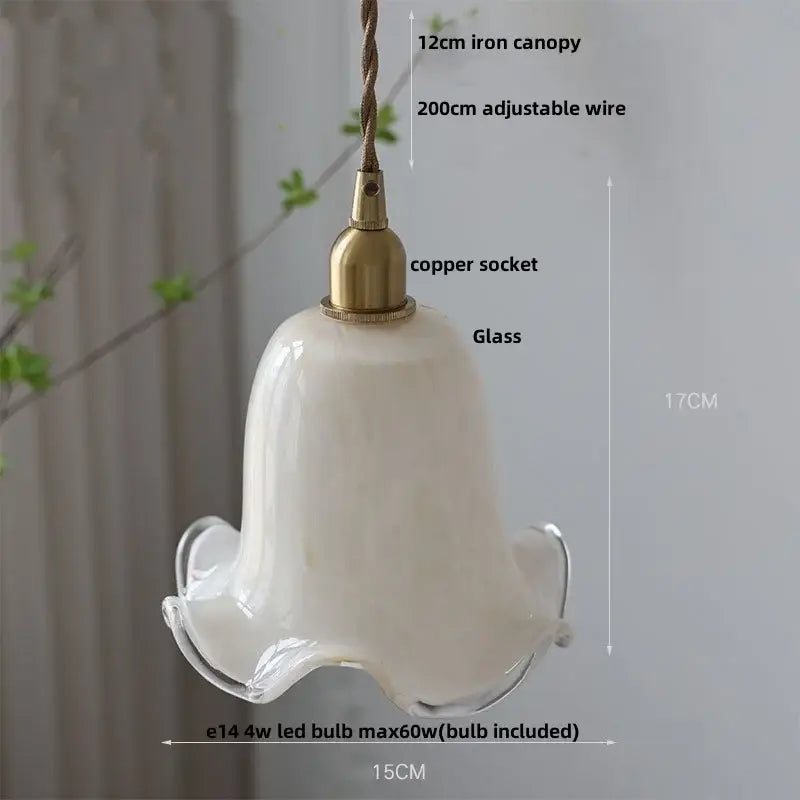 A modern off-white glass led pendant light with amber glass led style copper socket and iron canopy for kitchen use