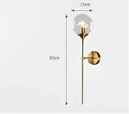 Modern amber glass led wall lamp with gold-toned brass sconce and clear globe for bedroom lighting