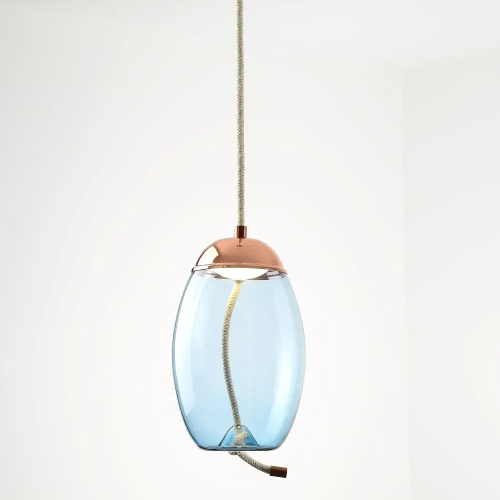 Modern amber glass pendant light with sleek translucent blue brokis knot glass and copper-toned metal accents from decorbites