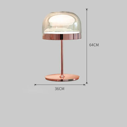 Modern amber glass pendant light with copper finish paired with a rose gold glass pendant light table lamp