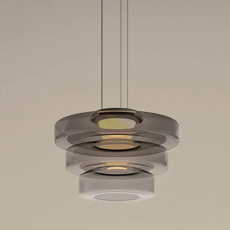 Modern amber glass plate ceiling pendant light with tiered translucent smoked glass rings and warm led illumination