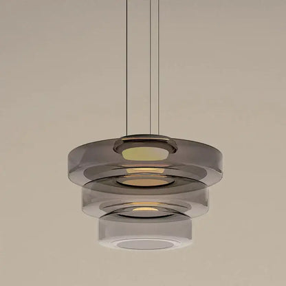 Modern amber glass plate ceiling pendant light with tiered translucent smoked glass rings and warm led illumination