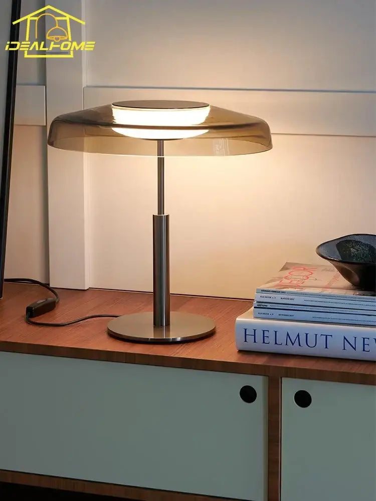 Modern amber glass table lamp with translucent shade and polished metallic base for red and gray bedroom decorbites dora glass table