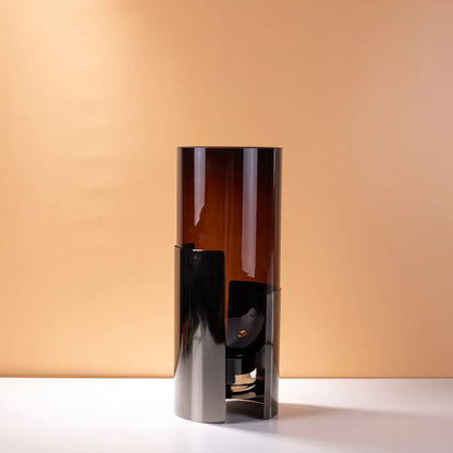 Modern amber glass vase set featuring a sleek table lamp with tall amber glass and polished black metal base decorbites amber glass