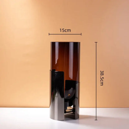 Tall amber glass vase with sleek black metal base and silver accents for modern decorbites amber glass living room decor