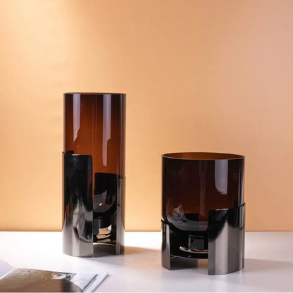 Two sleek modern decorbites amber glass vases with dark amber hue and silver metallic bases for living room decor