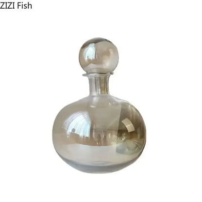Translucent rounded decorbites amber glass decanter with spherical stopper and subtle amber tint for modern decor