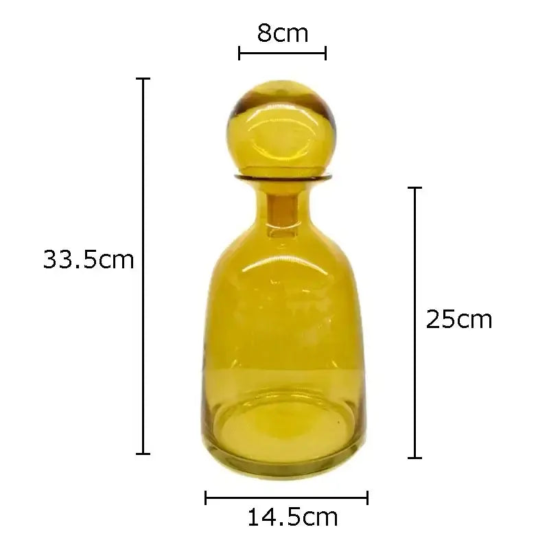 A translucent amber glass vase decanter with rounded body and spherical stopper from decorbites amber glass collection