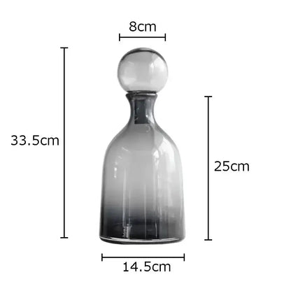 A sleek modern decorbites amber glass decanter with gradient glass and spherical stopper for living room decorbites amber vase trio