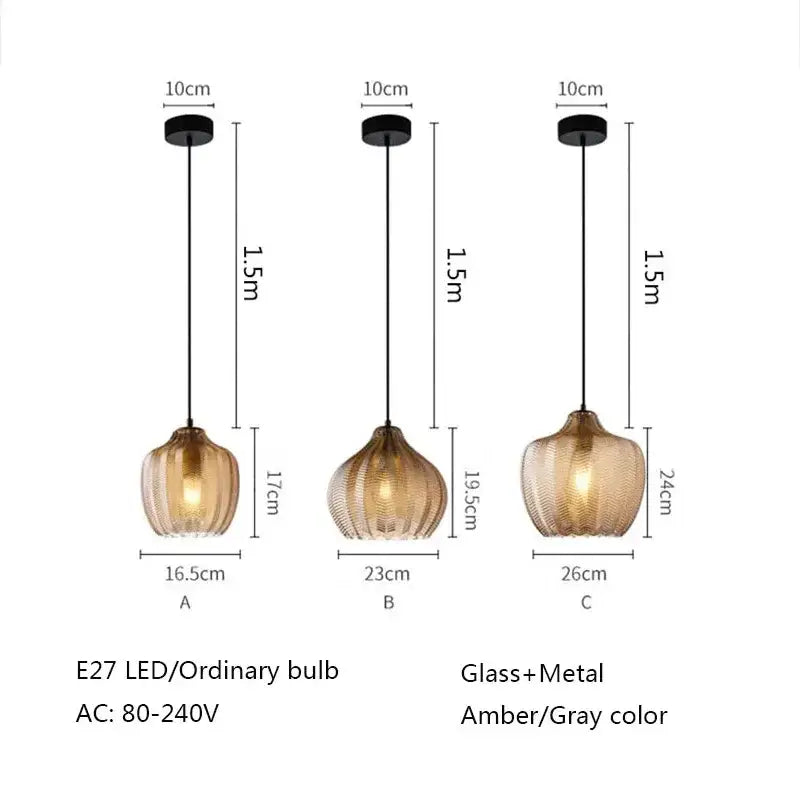 Three amber gray glass pendant lights with ribbed texture and black metal fixtures for modern dining room decorbites amber gray