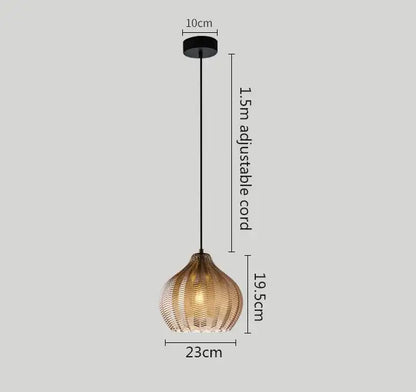 A warm-toned woven rattan pendant light with black adjustable cord complementing decorbites amber gray glass lamp