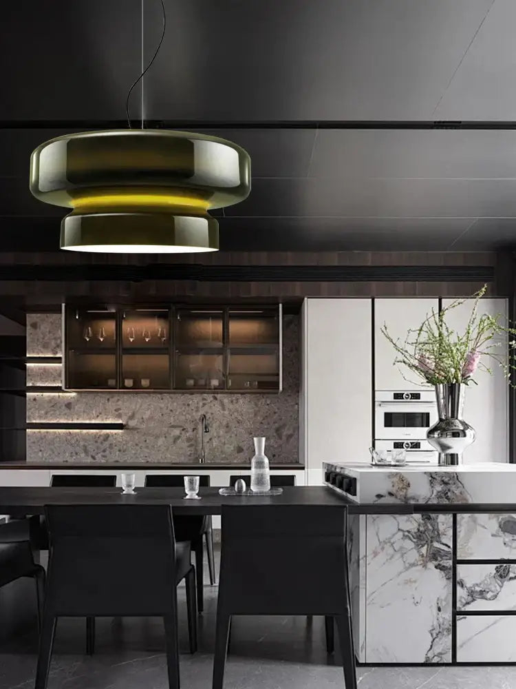 Modern amber green glass pendant light with layered translucent shade and metallic accents for dining room decorbites decor