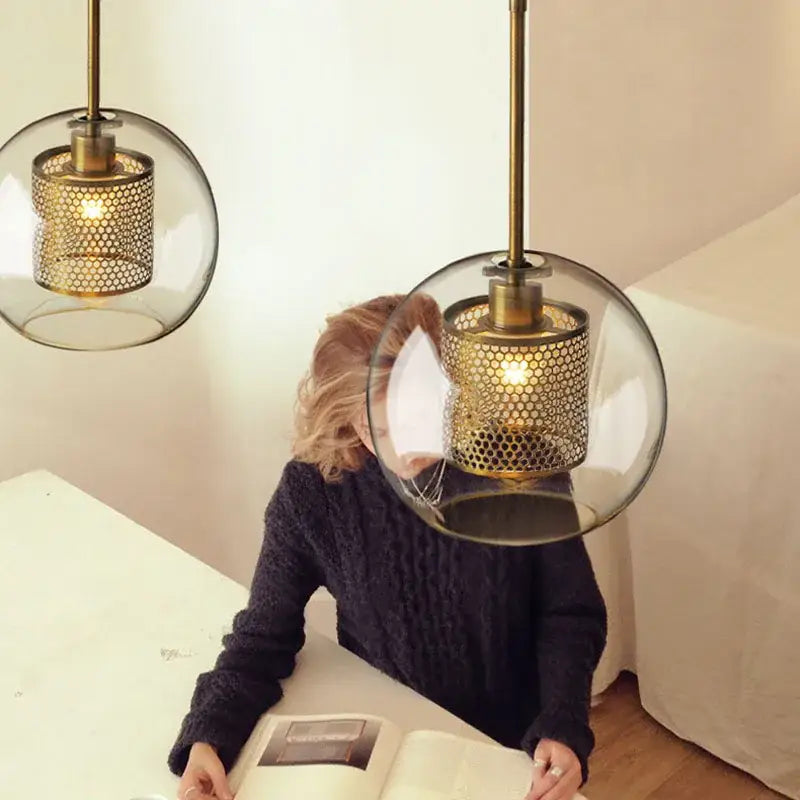 Brass-finished modern amber honeycomb decorbites glass ball pendant light with clear glass and mesh interior for kitchen