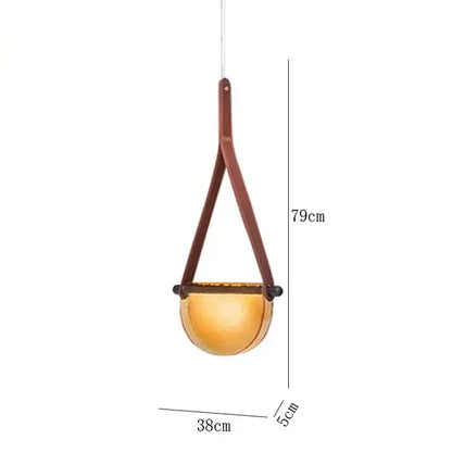 Modern amber and matte gray handmade glass pendant lamp with warm amber glass and brown leather strap for bedroom decorbites handmade glass pendant lamp