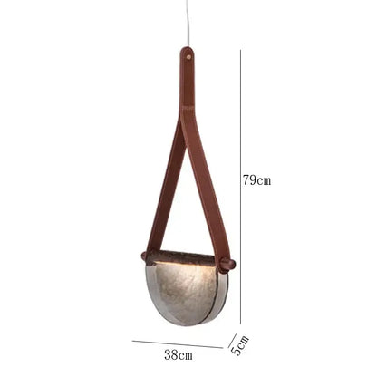 Modern amber and matte gray handmade glass pendant lamp with a hammered metallic shade and brown leather straps decorbites handmade glass