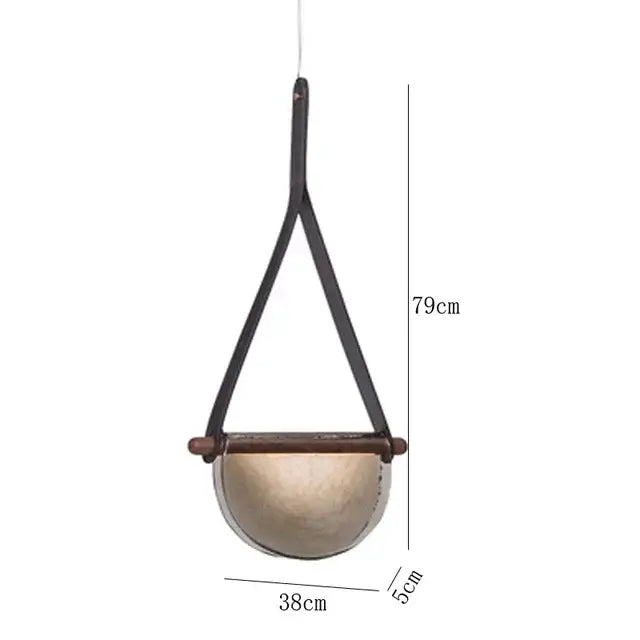 A rustic pendant lamp with matte gold ceramic bowl and leather straps showcasing decorbites handmade glass pendant lamp design